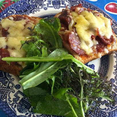 An open-faced sandwich with chutney, cheddar and Irish chorizo and a side of greens at The Cake Café.